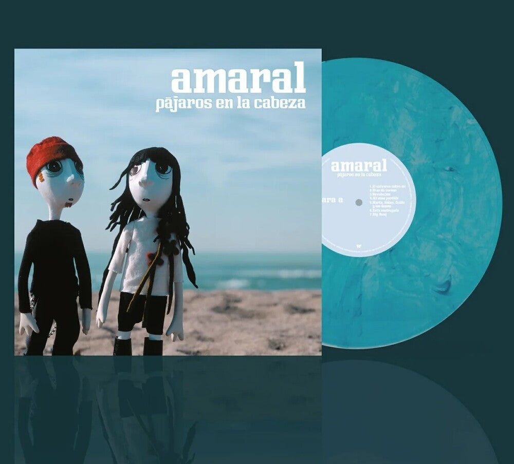 the album cover for Amaral - Pajaros En La Cabeza - Marbled Blue Vinyl (Blue)