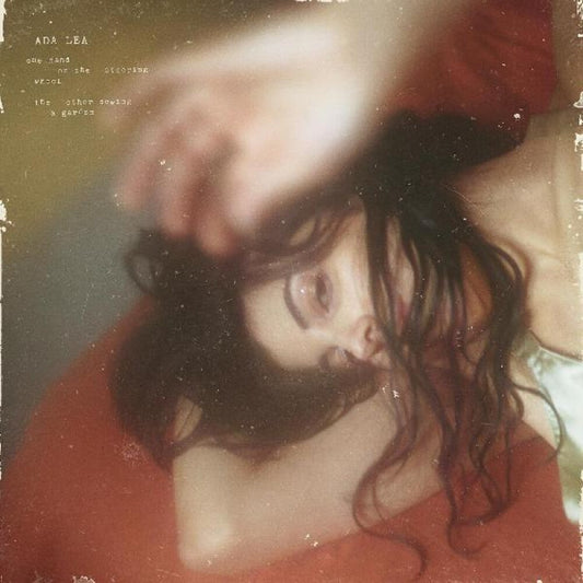 the album cover for Ada Lea - one hand on the steering wheel the other sewing a garden [Indie Exclusive Limited Edition Wine Stain LP]