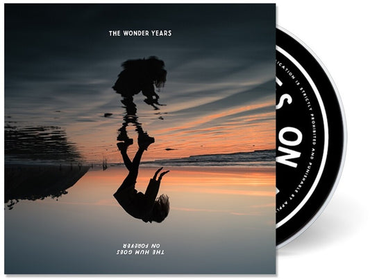 the album cover for The Wonder Years - The Hum Goes On Forever