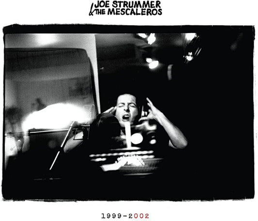the album cover for Joe Strummer & The Mescaleros - Joe Strummer 002: The Mescaleros Years [7LP / 32-Page Book]