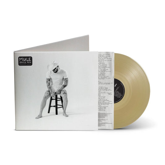 the album cover for Orville Peck - Mule [Indie Exclusive Tan Translucent]