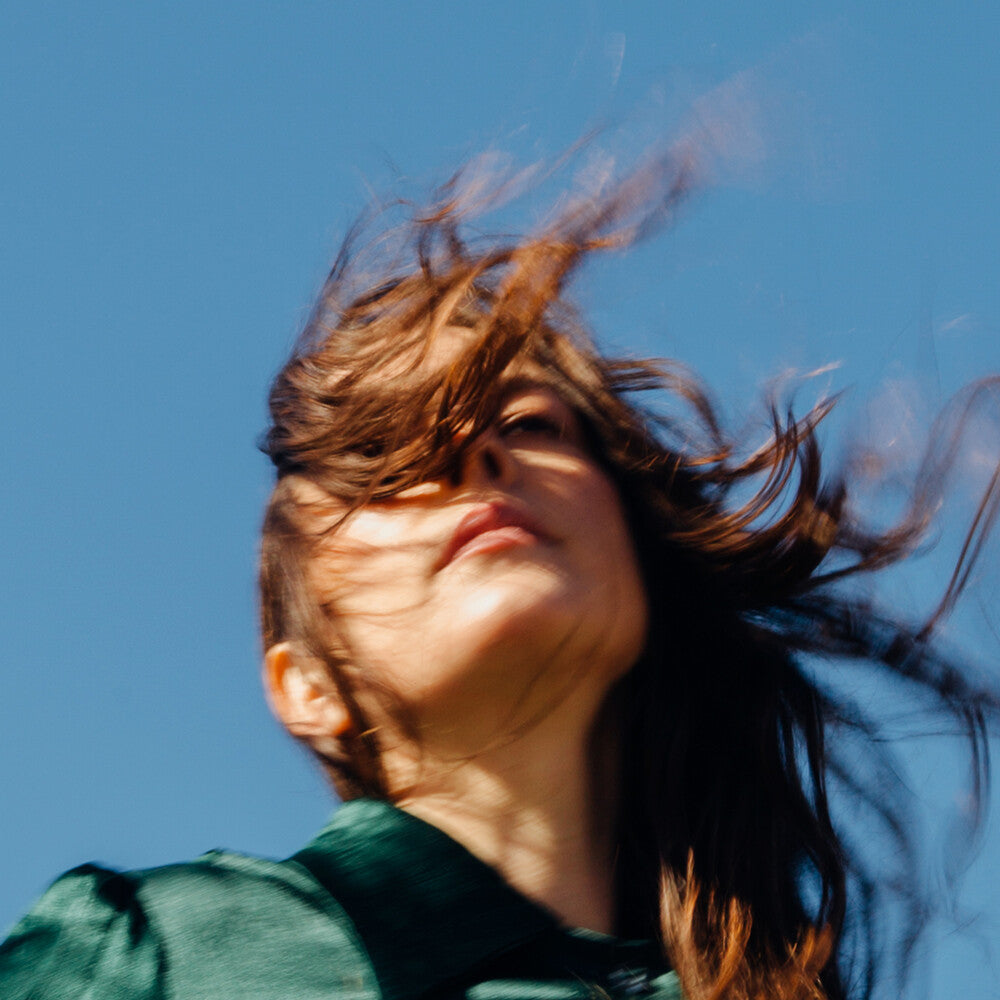the album cover for Madi Diaz - Weird Faith [Indie Exclusive Limited Edition Opaque Green LP]