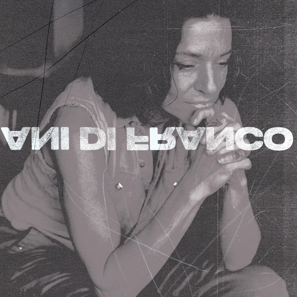 the album cover for ANI DIFRANCO	 - UNPRECEDENTED SH!T [INDIE EXCLUSIVE COKE BOTTLE CLEAR LP]	
