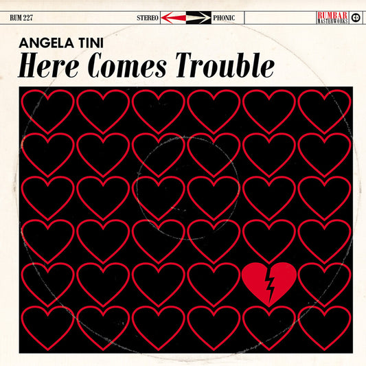 the album cover for Angela Tini - Here Comes Trouble [Deluxe] (Post)