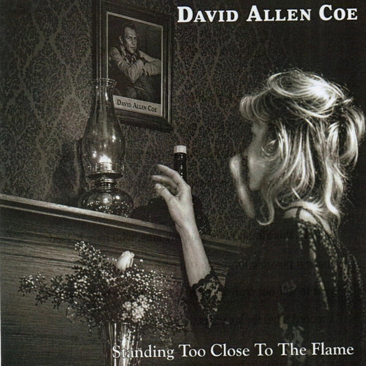 the album cover for David Allan Coe - Standing Too Close To the Flame